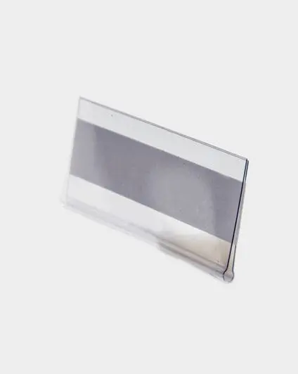 Clear plastic label holder on a white background.