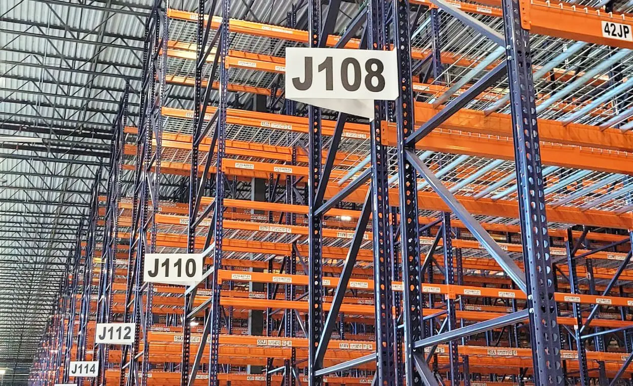 Empty warehouse racks labelled
