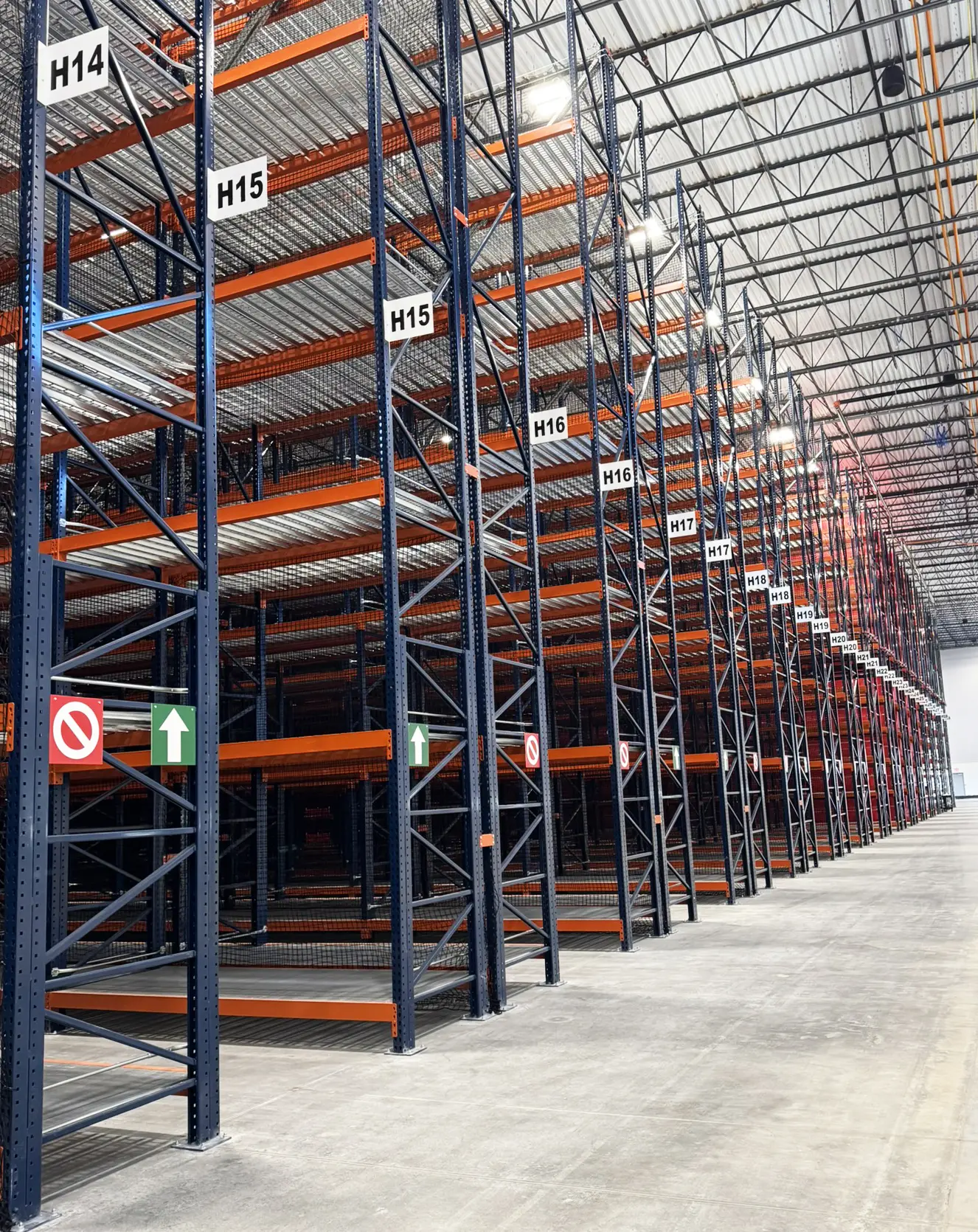 Illinois Chooses ASG Services for labelled sections and safety signs on empty warehouse racking.